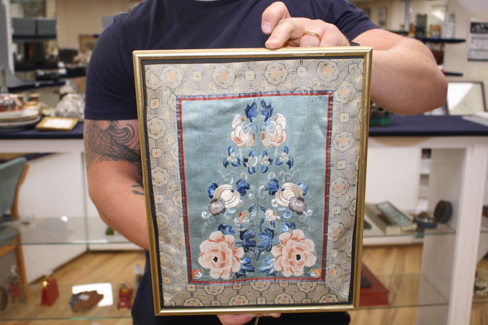 A Chinese silkwork double sleeve panel, 77 x 18cm overall, a smaller floral panel, 61 x 11cm and another, 34 x 26cm overall